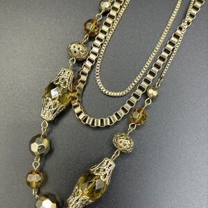 Long multi chain,gold tones, peridot like bead, EUC, vintage, fashion jewellery